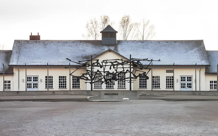 Dachau Concentration Camp Memorial sculpture and building facade.