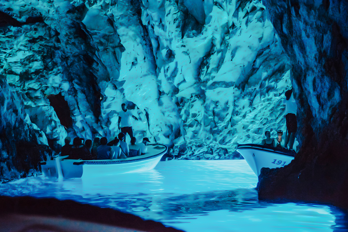 Boat tour inside Blue Cave, part of Blue Lagoon and 5 Islands tour.
