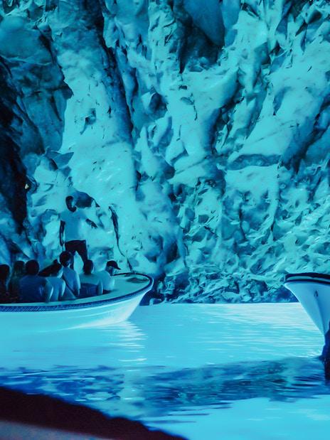 Boat tour inside Blue Cave, part of Blue Lagoon and 5 Islands tour.