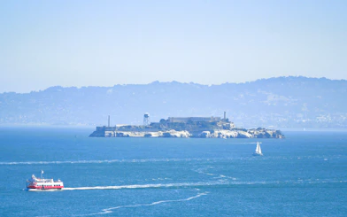 Cruise boat near Alcatraz Island on Golden Gate Bridge tour, San Francisco Bay.