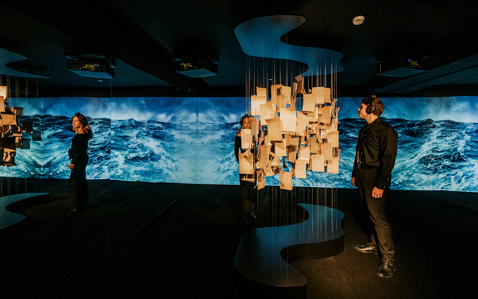 Visitors exploring an interactive exhibit at the Johann Strauss Museum in Vienna.