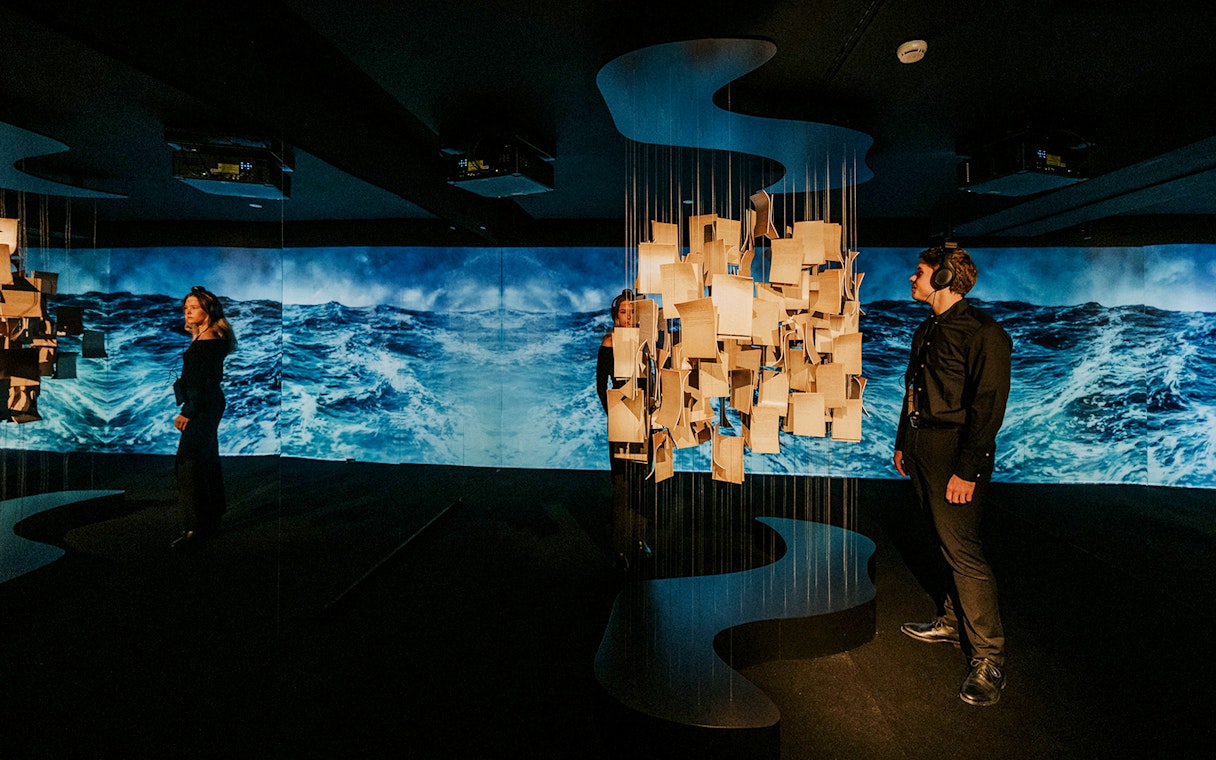 Visitors exploring an interactive exhibit at the Johann Strauss Museum in Vienna.