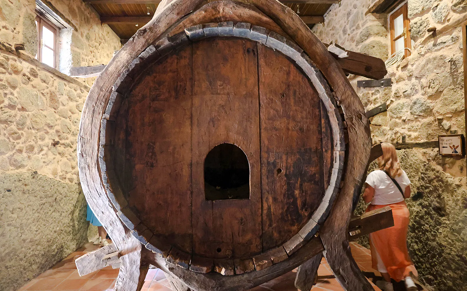 Large wooden water barrel inside Monastery of Varlaam, Meteora.