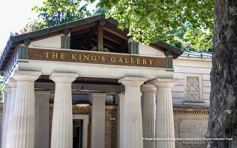 Entrance to The King's Gallery at Buckingham Palace with columns and trees.