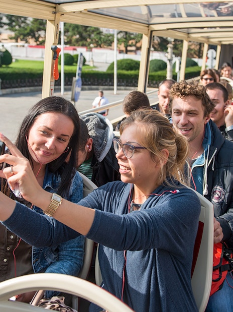 Passengers taking photos on a Vienna Hop-On Hop-Off bus tour.