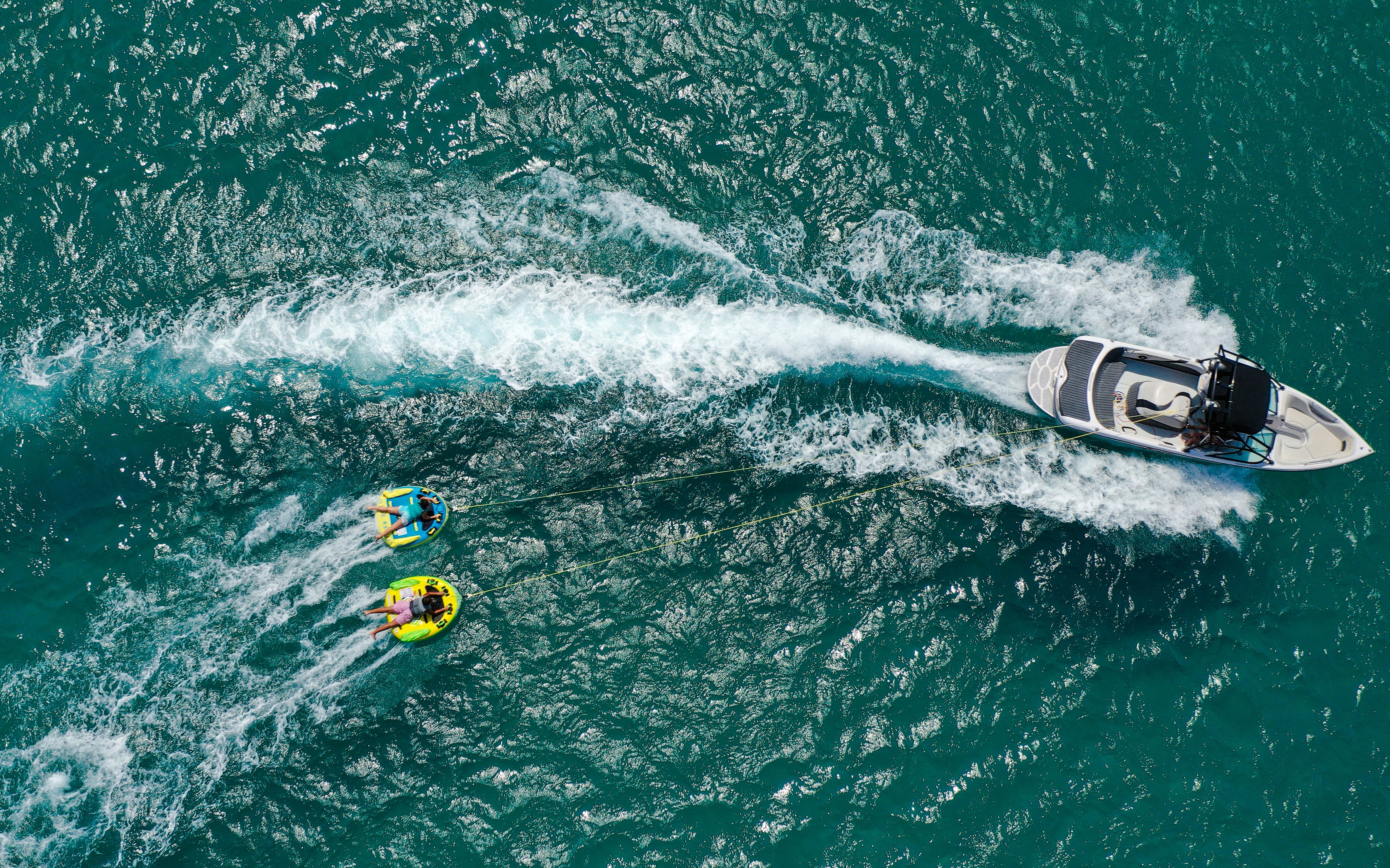 Aerial view of donut boat water sports in Dubai.