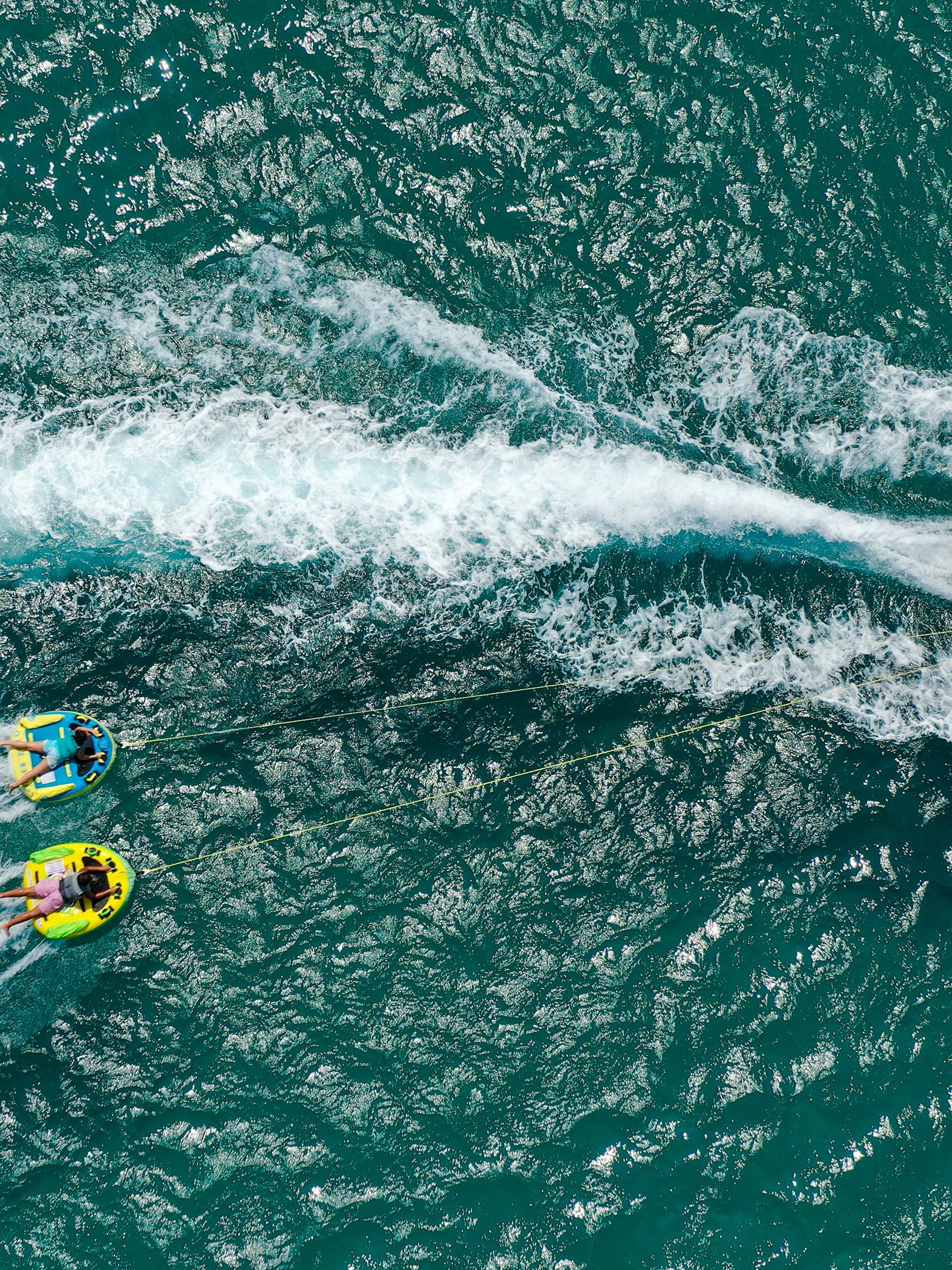 Aerial view of donut boat water sports in Dubai.