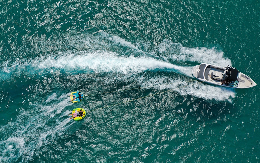 Aerial view of donut boat water sports in Dubai.