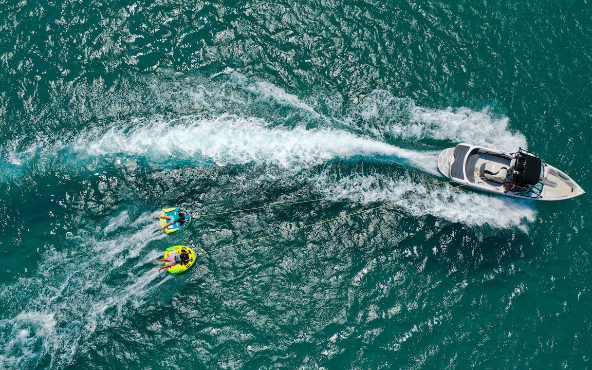 Aerial view of donut boat water sports in Dubai.