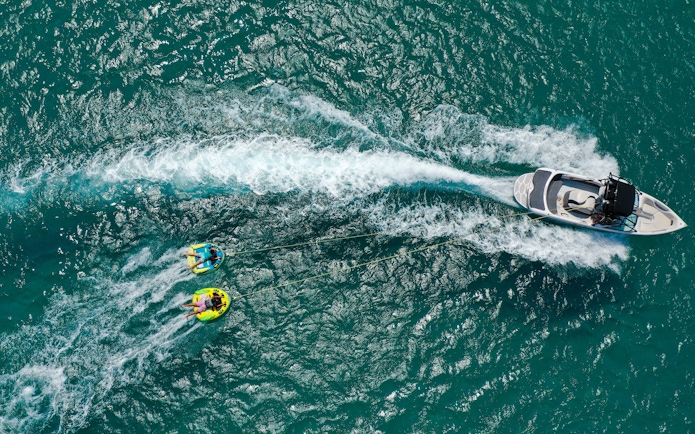 Aerial view of donut boat water sports in Dubai.