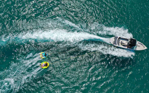 Aerial view of donut boat water sports in Dubai.