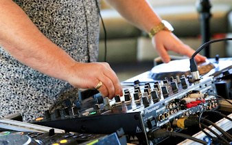 DJ mixing music on cruise in Washington DC.