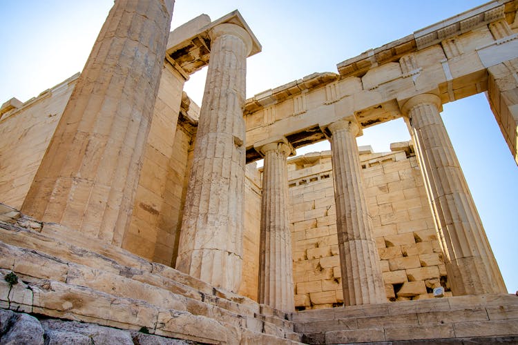 Propylaea gateway ruins at the Acropolis, Athens, showcasing ancient Greek architecture.