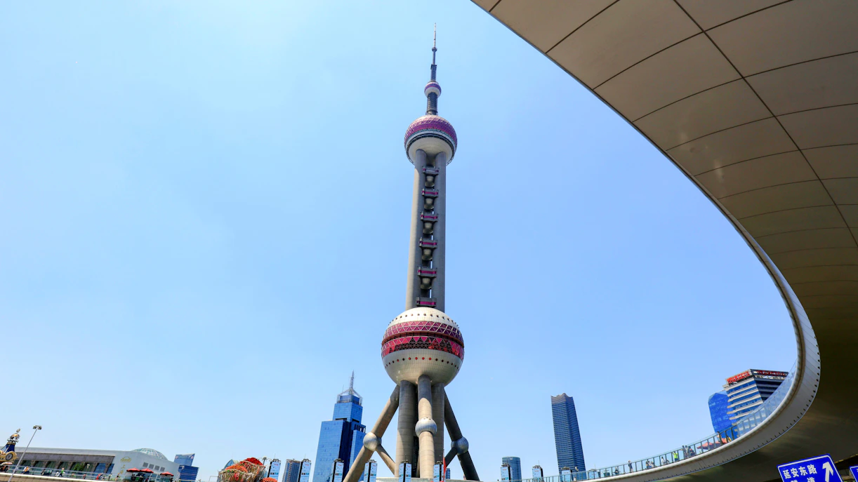 Oriental Pearl TV Tower in Shanghai, China with city skyline in the background.