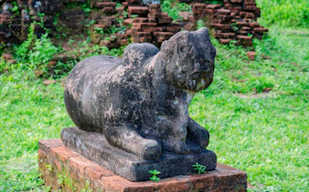 Stone guardian animal sculpture at My Son Sanctuary, Vietnam.