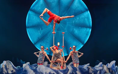 Acrobats performing a balancing act in Cirque du Soleil's Luzia show.