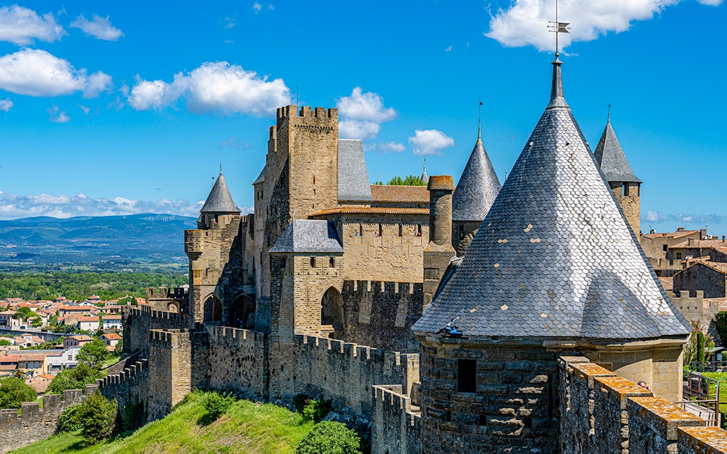 Carcassonne Castle's Tour de la Justice with medieval towers and city view.