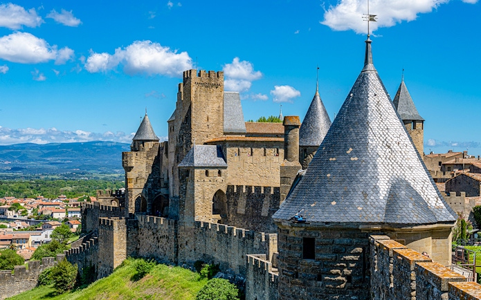 Carcassonne Castle's Tour de la Justice with medieval towers and city view.