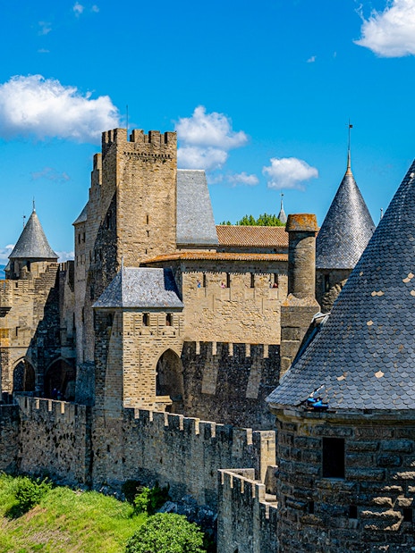 Carcassonne Castle's Tour de la Justice with medieval towers and city view.
