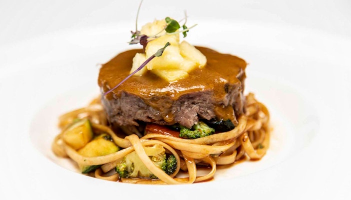 La carte dinner with beef and pasta at Tablao El Arenal.