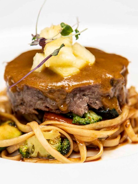 La carte dinner with beef and pasta at Tablao El Arenal.