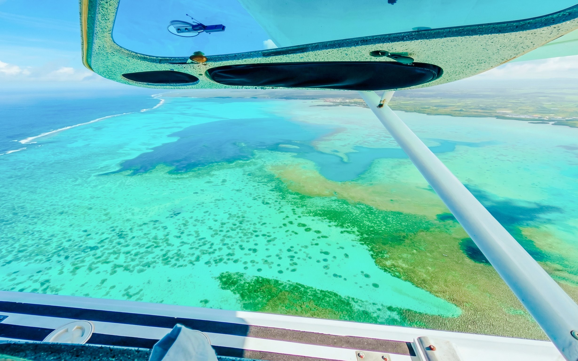Aerial view of the Eastern Underwater Waterfall from a seaplane, Mauritius.