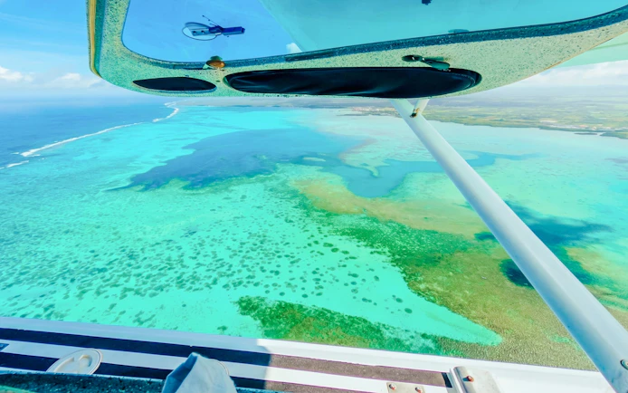 Aerial view of the Eastern Underwater Waterfall from a seaplane, Mauritius.