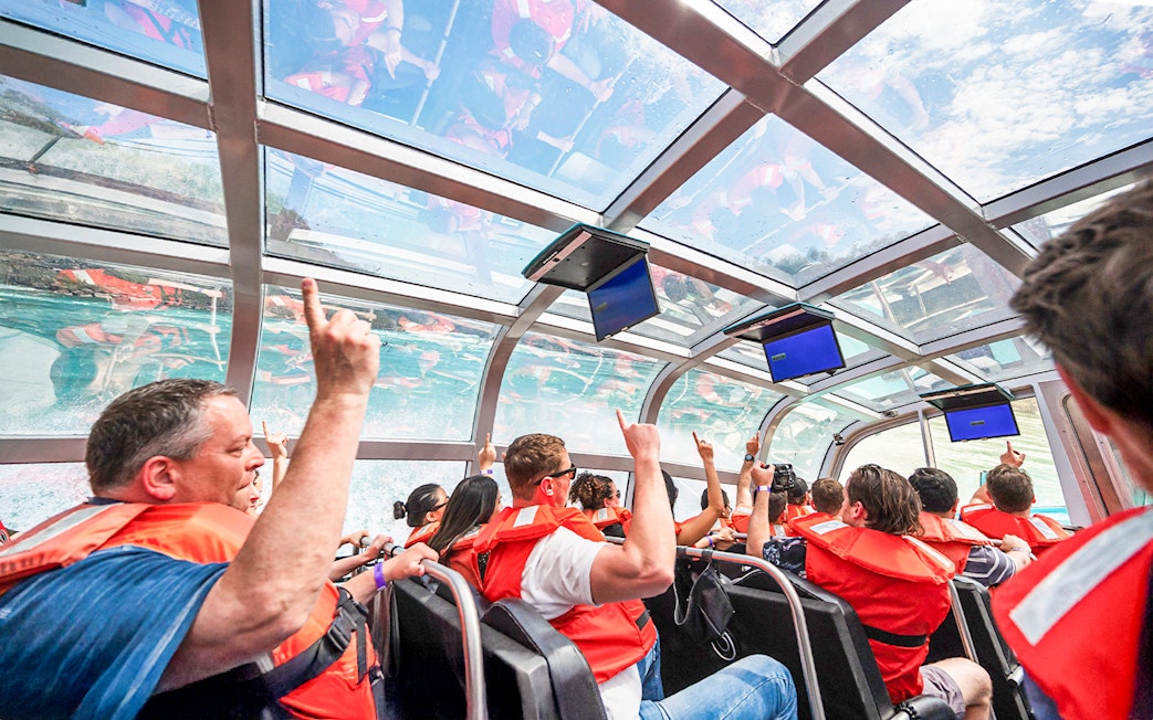 Guests enjoying the Freedom jet boat tour in the Niagara River Gorge, Canada.