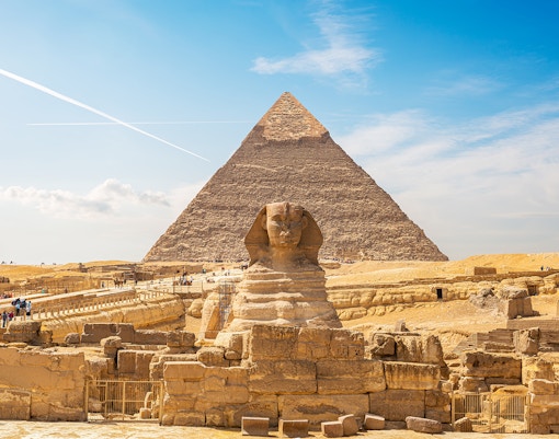 Sphinx and Pyramid of Giza on a sunny day, part of Cairo's private half-day tour.