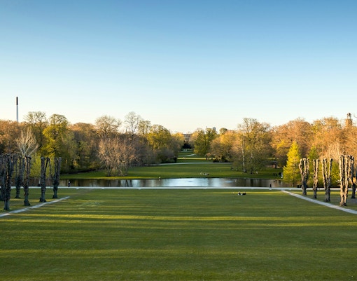 Frederiksberg Gardens in Copenhagen with scenic pathways and lush greenery.