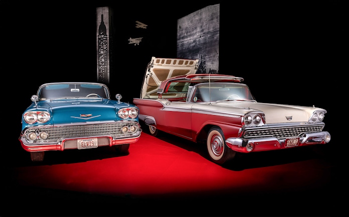 Classic cars display at Technik Museum Sinsheim with vintage license plates.