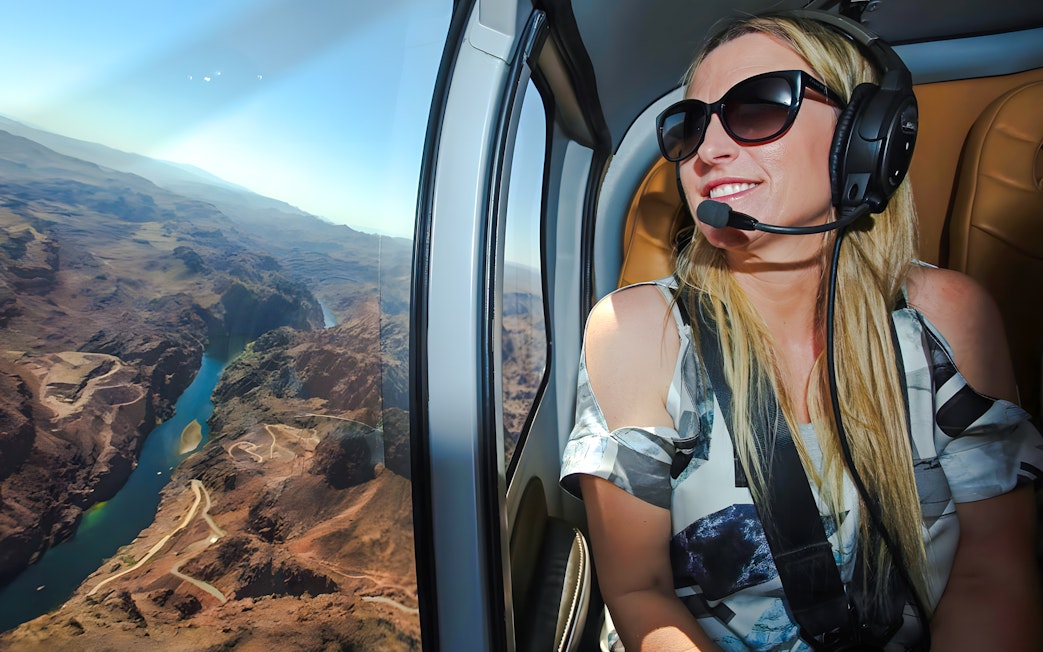 Guest enjoying aerial view of Grand Canyon West Rim from helicopter, Las Vegas tour.