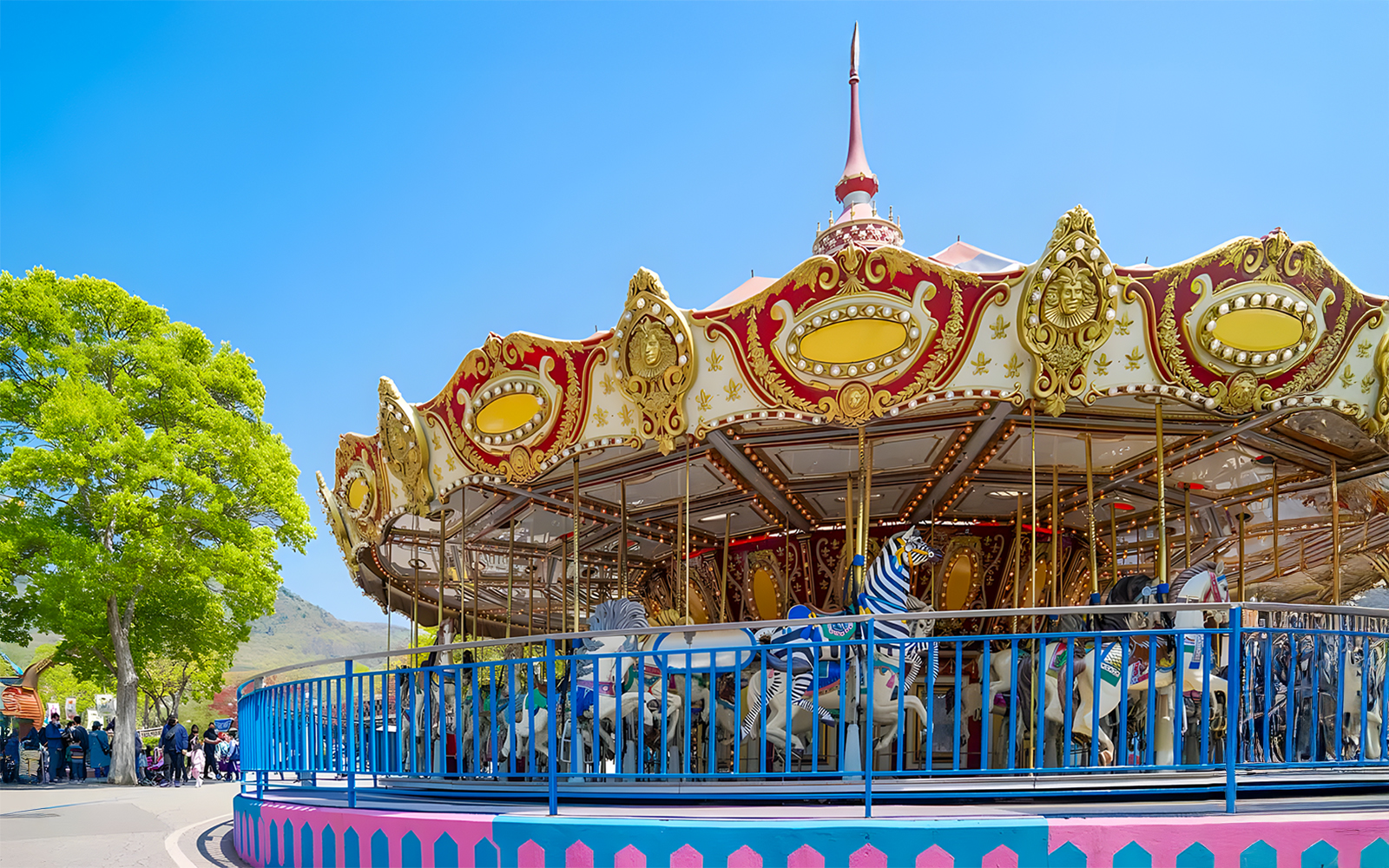 Carousel at Seoul Land amusement park with colorful horses and ornate decorations.