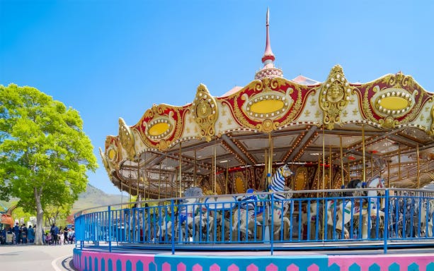 Carousel at Seoul Land amusement park with colorful horses and ornate decorations.