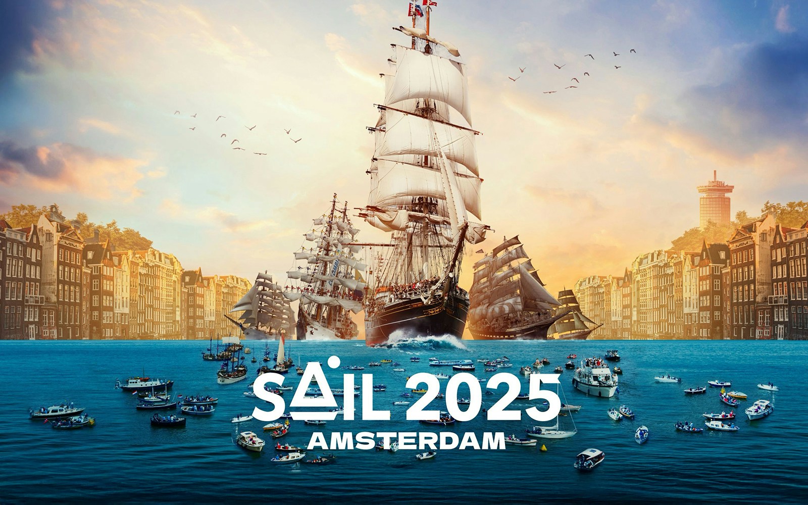 Tall ships sailing in Amsterdam harbor with historic buildings in the background.