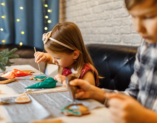 Children decorate gingerbread cookies, Christmas activity