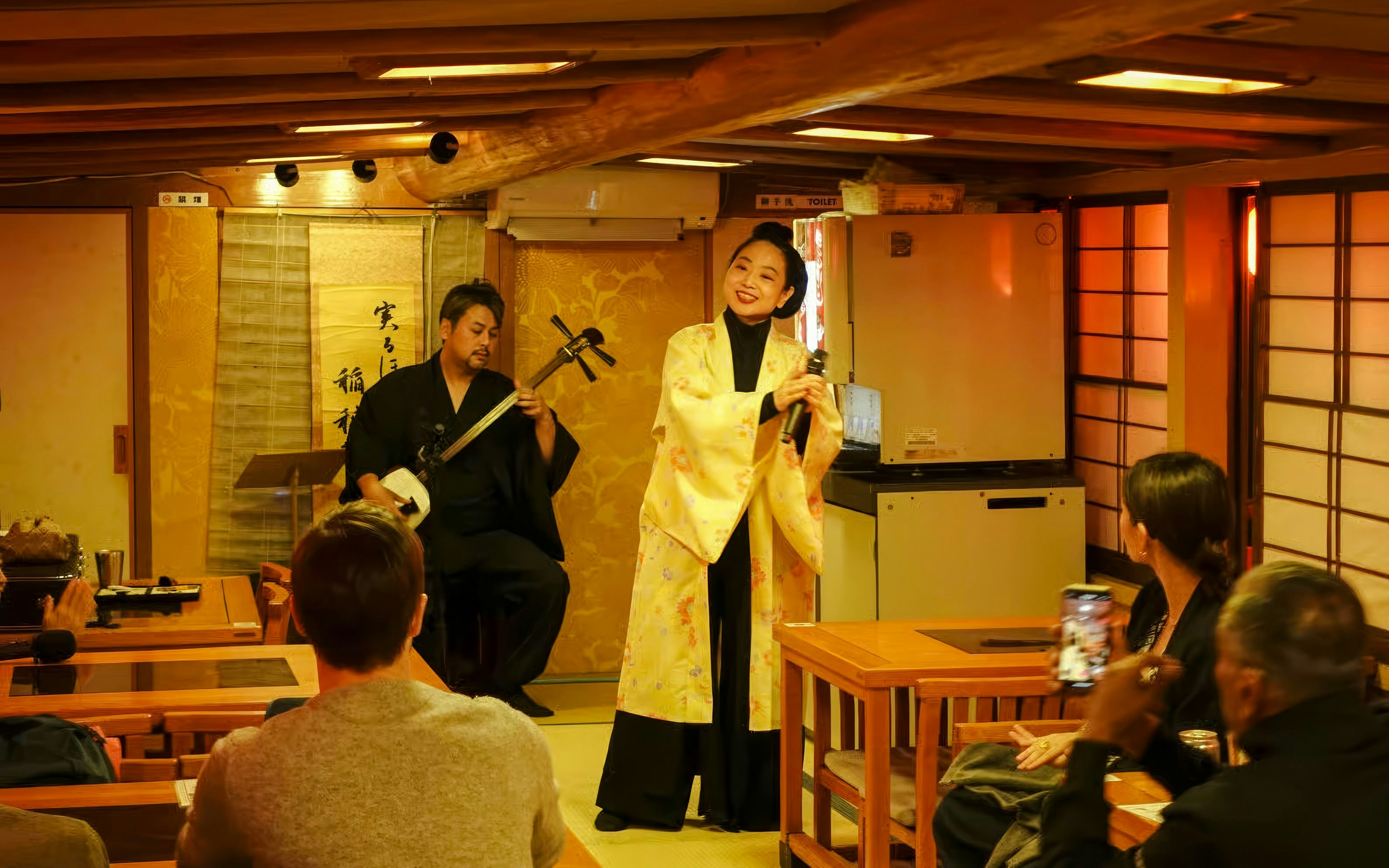 Traditional music performance on a Yakatabune cruise in Japan.