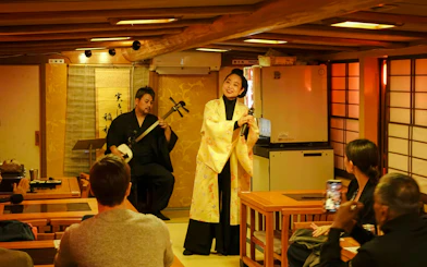 Traditional music performance on a Yakatabune cruise in Japan.