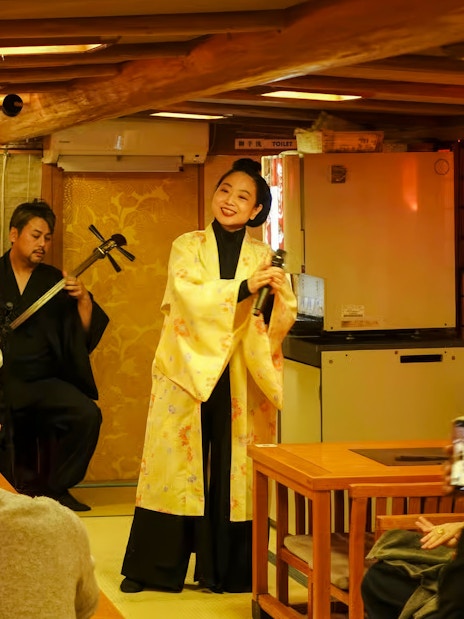 Traditional music performance on a Yakatabune cruise in Japan.