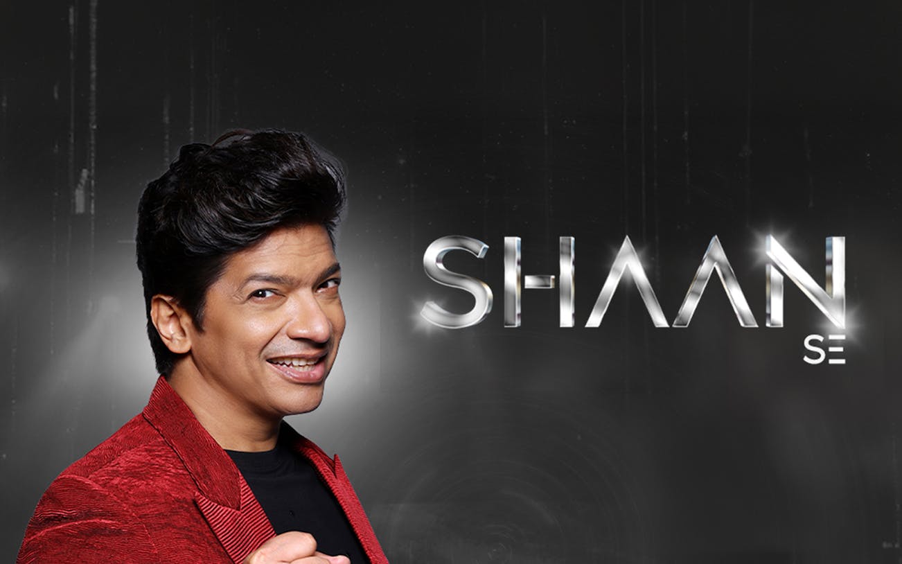 Performer in red jacket promoting Shaan Se concert at Coca-Cola Arena, Dubai