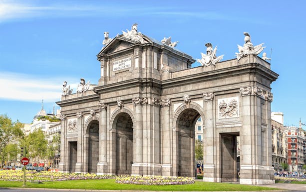Puerta de Alcalá in Madrid, part of guided tour with Prado Museum entry.