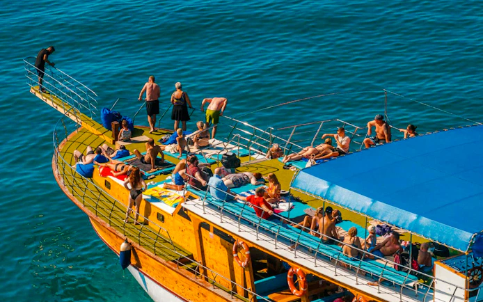 Guests relaxing on a boat deck during Alanya Boat Day Tour.