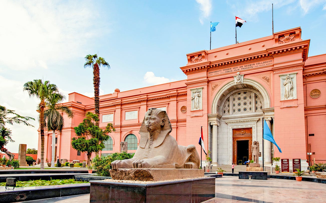 Egyptian Museum entrance with sphinx statue, Cairo, part of the Giza historical tour.