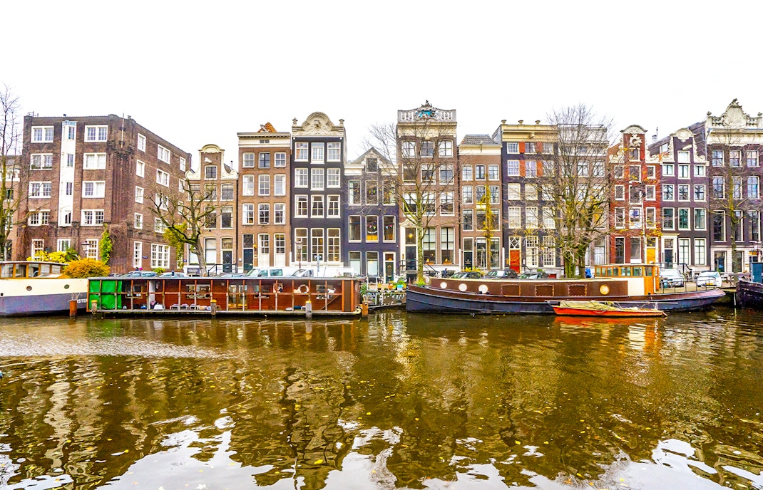 Canal houses and boats along Prinsengracht in Amsterdam.