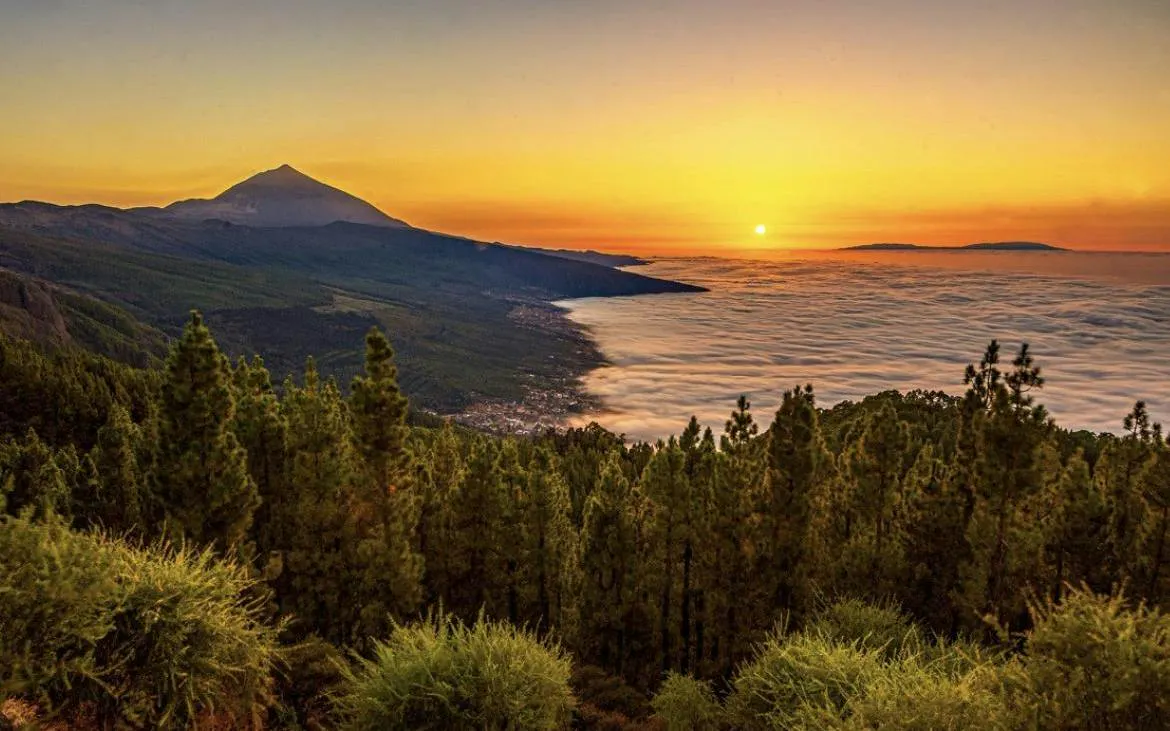 Sunset view over Teide National Park with Masca Village and ocean in Tenerife.