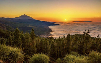 Sunset view over Teide National Park with Masca Village and ocean in Tenerife.