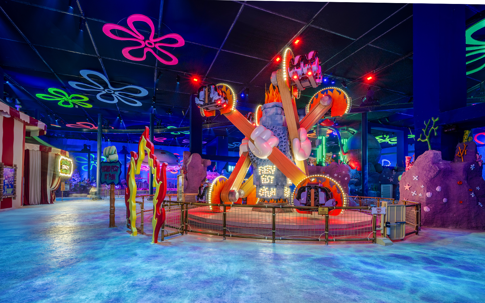 Colorful ride at Nickland in The Land of Legends theme park, featuring vibrant lights and decorations.