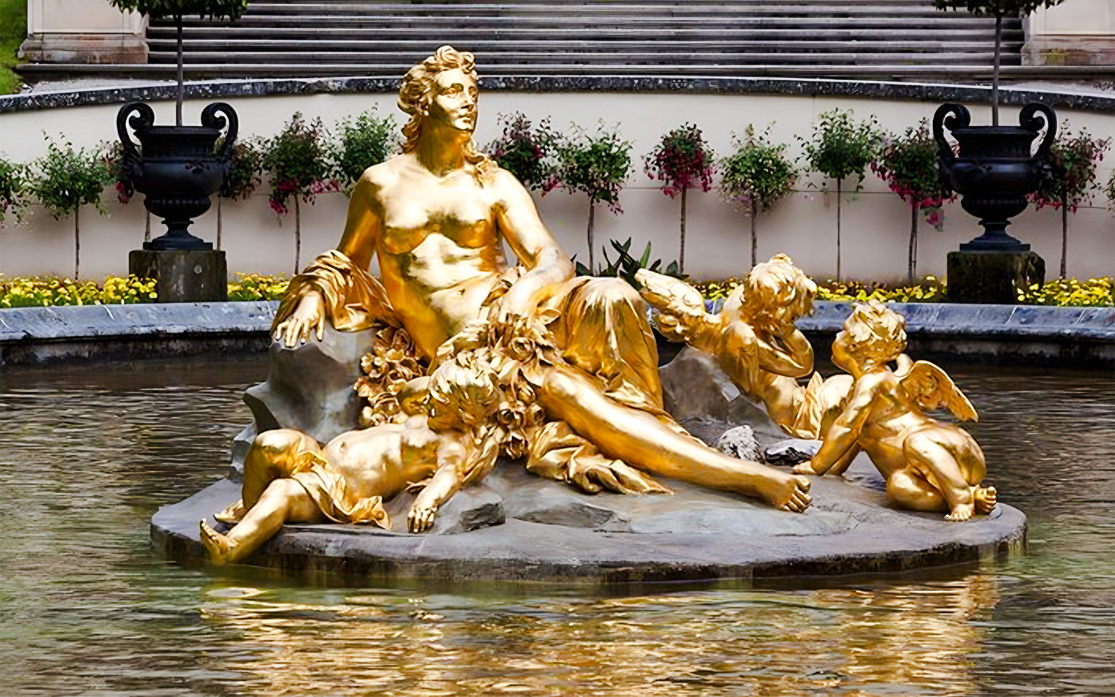 Golden statue in the fountain at Linderhof Palace, Germany.