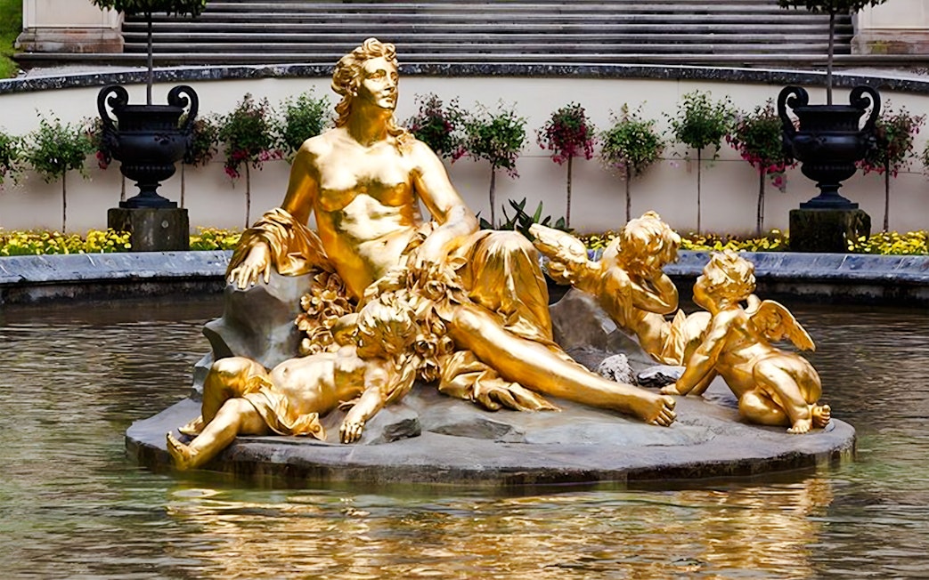 Golden statue in the fountain at Linderhof Palace, Germany.