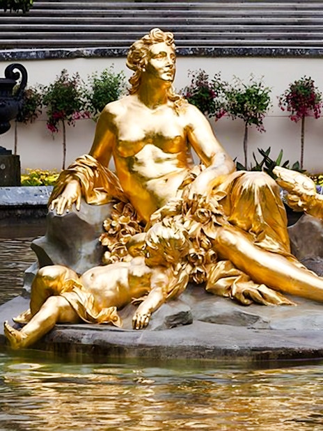 Golden statue in the fountain at Linderhof Palace, Germany.